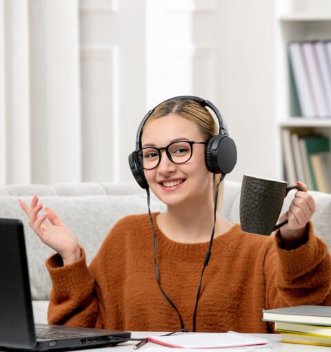 Student enjoying a live online class with headphones